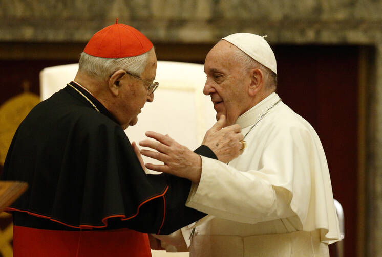 Pope Francis greets Cardinal Angelo Sodano, now dean emeritus of the College of Cardinals, during his annual audience to give Christmas greetings to members of the Roman Curia at the Vatican Dec. 21, 2019. (CNS photo/Paul Haring)