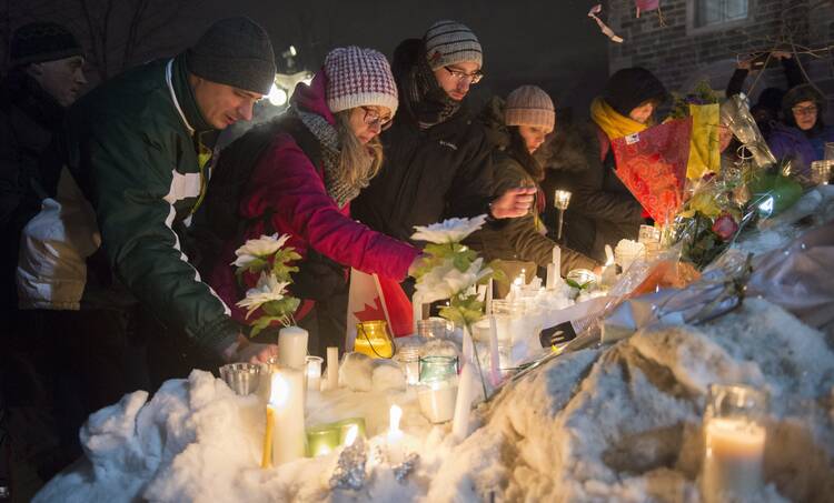 A vigil in Quebec City on Jan. 30 for victims of Sunday's deadly shooting at a Quebec City mosque. (Paul Chiasson/The Canadian Press via AP)