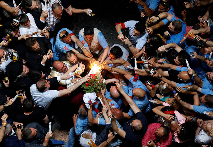 Worshippers light their candles as they take part in the Christian Orthodox Holy Fire ceremony at the Church of the Holy Sepulchre in Jerusalem’s Old City on April 30, 2016. Photo courtesy of Reuters/Ammar Awad