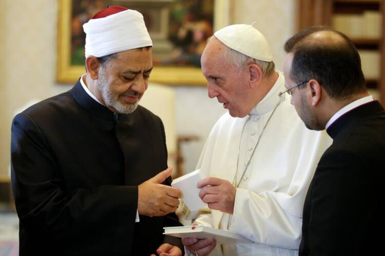 Pope Francis exchanges gifts with Ahmad el-Tayeb, grand imam of Egypt's al-Azhar mosque and university, during a private meeting at the Vatican May 23. (CNS photo/Max Rossi, Reuters) 