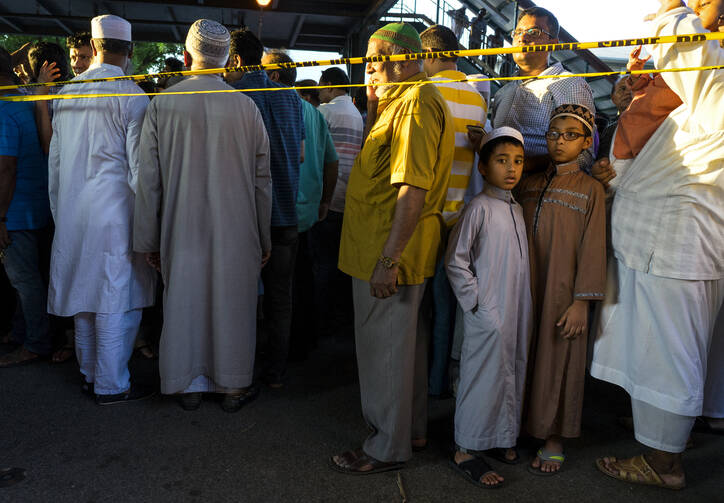 Fear for the Future. People gather for a demonstration on Aug. 13 near a crime scene after the leader of a Queens mosque and an associate were fatally shot as they left afternoon prayers. (AP Photo/Craig Ruttle)