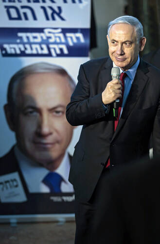 Israeli Prime Minister Benjamin Netanyahu speaks to Likud party members in a campaign stop in Netanya, Israel, March 11 (CNS photo/Jim Hollander, EPA).