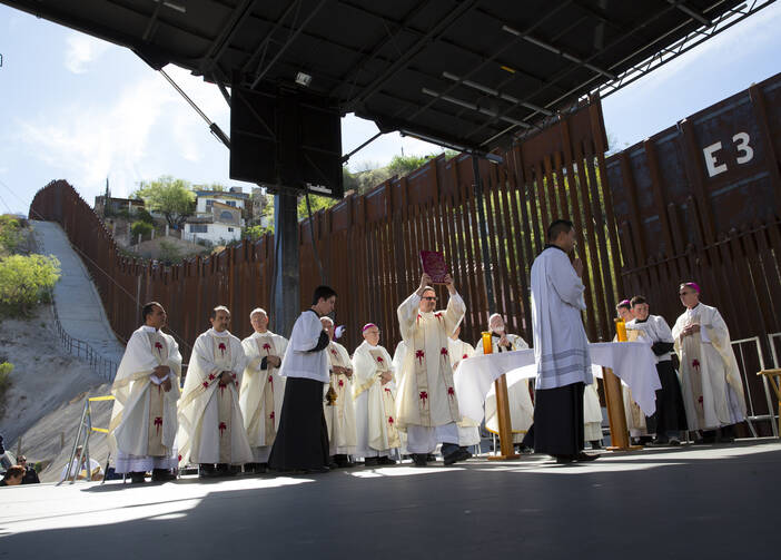 U.S. bishops, led by Cardinal Sean P. O'Malley of Boston, celebrates Mass at the border fence in Nogales, Ariz., in April. (CNS photo/Nancy Wiechec) 