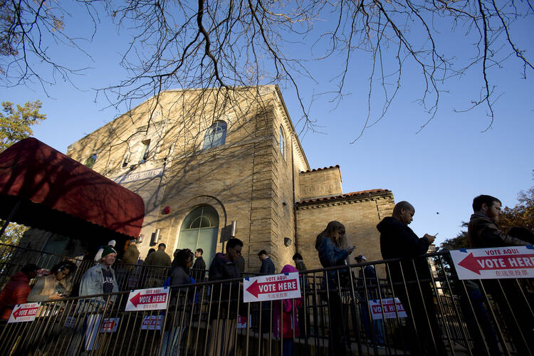 Voters wait in line outside St. Francis Hall in Washington, Nov. 8 (CNS photo/Tyler Orsburn).
