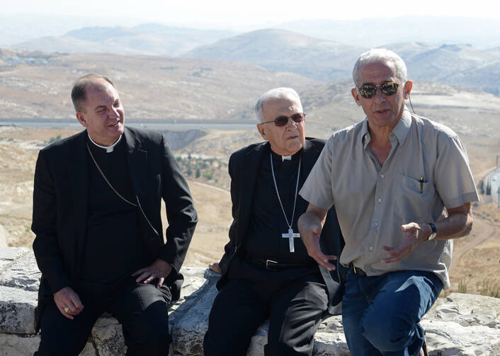 U.S. bishops listen as Israeli attorney gives explanation of land use around Jerusalem.