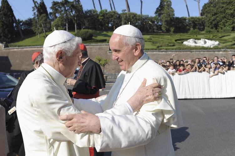 Pope Francis embraces retired Pope Benedict during ceremony in Vatican gardens, July 5, 2013