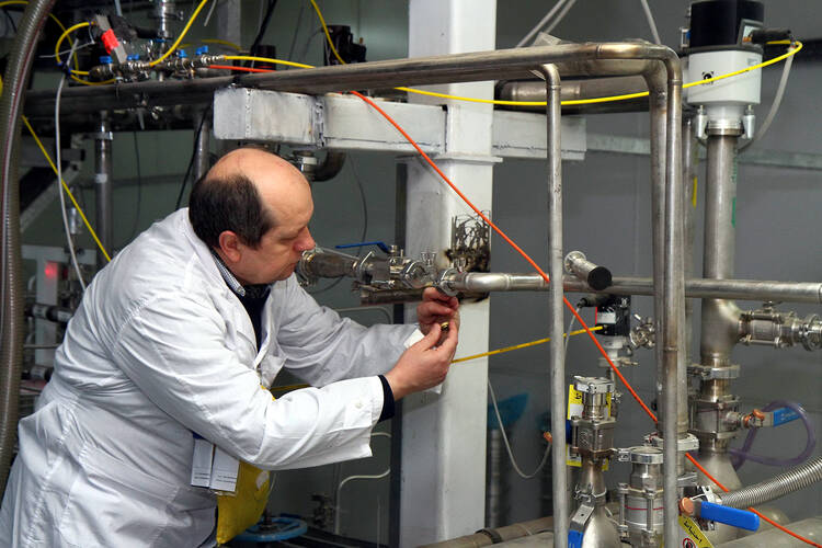 An International Atomic Energy Agency inspector checks the uranium enrichment process inside Iran's Natanz plant in January 2014.