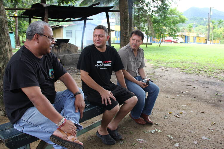 The delegation meets with Chabelo Morales (center) at the penal farm of La Ceiba, Honduras, on Sept. 9, 2013. Chabelo was sentenced to prison without an opportunity to defend himself in court.