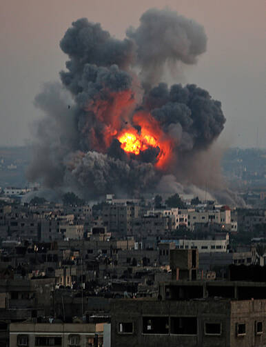 Smoke rises after an an Israeli airstrike in Gaza City, July 8.