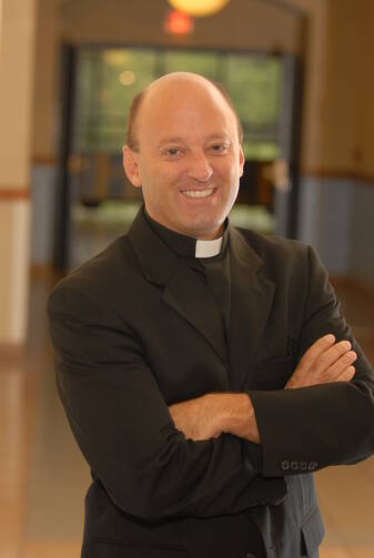 Father John Belmonte, S.J. (Diocese of Joliet)
