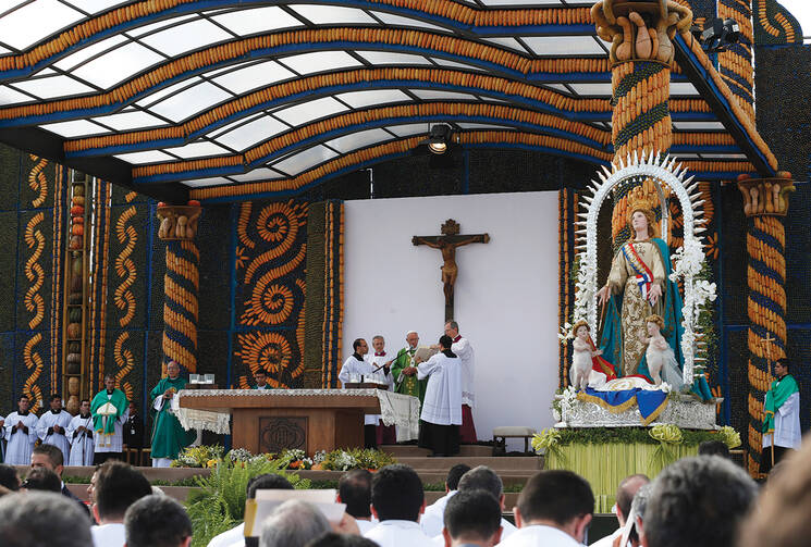 AT TABLE. Pope Francis celebrates Mass in Nu Guazu Park in Asuncion, Paraguay, July 12.