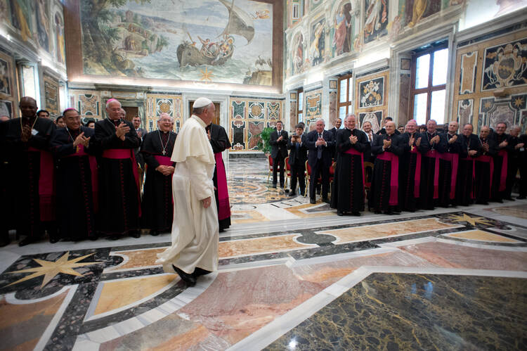 Pope Francis arrives for meeting with Catholic communicators during audience at Vatican