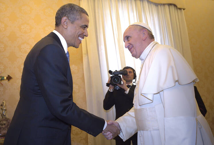 U.S. President Barack Obama shakes hands with Pope Francis during a private audience at the Vatican March 27. (CNS photo/Stefano Spaziani, pool)