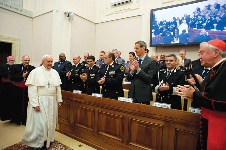 Traffick Cops: Pope francis arrives for the final session.