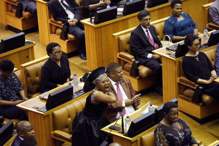 A member of Parliament shouts as the Economic Freedom Fighters political party disrupts President Jacob Zuma's attempt to give his State of the Nation address in Cape Town, South Africa, on February 11. (AP Photo/Schalk van Zuydam, Pool)