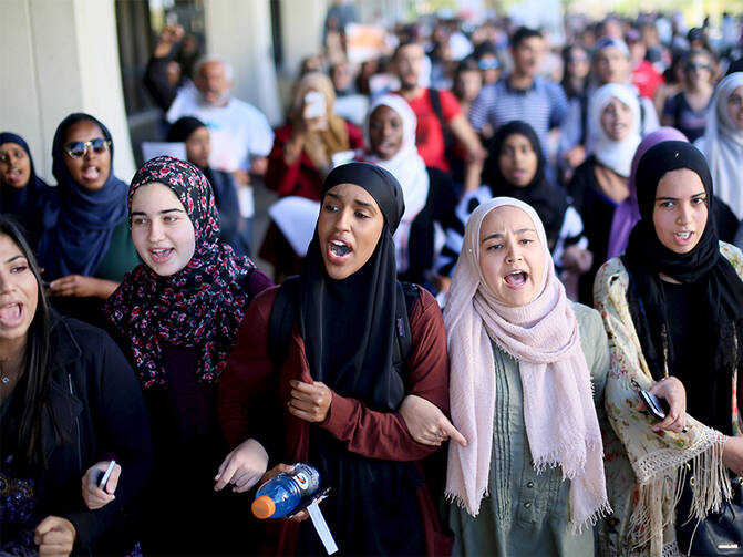 Students chant while marching at a rally against Islamophobia at San Diego State University in San Diego, Calif., on November 23, 2015. Photo courtesy of REUTERS/Sandy Huffaker