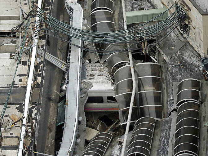 A derailed New Jersey Transit train is seen under a collapsed roof after it derailed and crashed into the station in Hoboken, N.J., on Sept. 29, 2016. Photo courtesy of REUTERS/Carlo Allegri