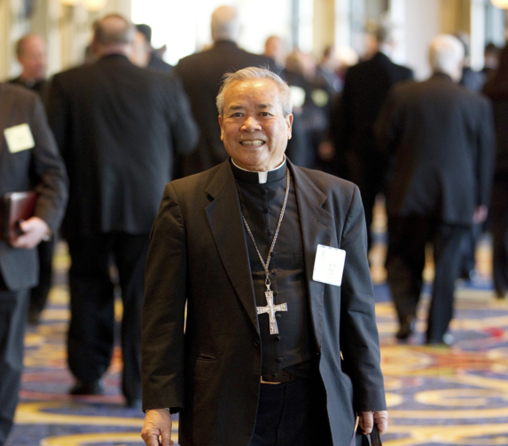 Auxiliary Bishop Dominic M. Luong of Orange, Calif., arrives for the opening day of the annual fall meeting of the U.S. bishops' conference in Baltimore Nov. 14, 2011. (CNS photo/Nancy Phelan Wiechec)