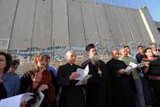 Christian leaders pray in front of the Israeli separation wall near Rachel's Tomb in Bethlehem, West Bank, May 29, the beginning of the 2010 World Week for Peace in Palestine and Israel. (CNS photo/Debbie Hill) 
