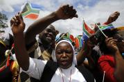 Nun marches with mourners before the arrival of body of former South African President Nelson Mandela in Mthatha.