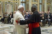  Pope Francis shakes hands with Ghanaian Cardinal Peter Turkson, president of the Pontifical Council for Justice and Peace, during a meeting with council members at the Vatican June 16. (CNS photo/L'Osservatore Romano via Reuters)