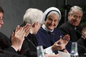 Sister Sharon Holland, president of the Leadership Conference of Women Religious, receives applause at Vatican press conference for release of final report of Vatican-ordered investigation of U.S. communities of women religious.