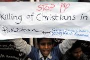 A Pakistani Christian boy holds a banner during a late March protest in Karachi after attacks on churches in Lahore last year.