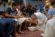 Argentine Cardinal Jorge Mario Bergoglio washes and kisses the feet of residents of a shelter for drug users during Holy Thursday Mass in 2008 at a church in a poor neighborhood of Buenos Aires, Argentina. The challenges and experiences of the church in Latin America figure heavily in Pope Francis' papacy, especially when it comes to making bishop appointments, addressing global issues and the pastoral care of the poor and the marginalized. (CNS photo/Enrique Garcia Medina, Reuters) See VATICAN-LETTER-LATIN