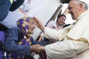  Pope Francis greets an elderly woman as he meets with people in a poor neighborhood in Asuncion, Paraguay, in this July 12, 2015, file photo. Pastoral care of the poor and those in need has been emphasis of the pontificate of Pope Francis. (CNS photo/Paul Haring) 