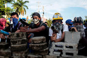 Demonstrators in Managua, Nicaragua, stand behind a barricade during clashes with police May 30. (CNS photo/Oswaldo Rivas, Reuters) 