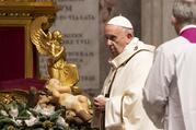 Pope Francis walks near a figurine of the baby Jesus as he celebrates Mass in St. Peter's Basilica at the Vatican Dec. 24, 2020. (CNS photo/Cristian Gennari, pool)