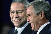 In this Dec. 16. 2000 file photo, President-elect Bush smiles as he introduces retired Gen. Colin Powell, left, as his nominee to be secretary of state during a ceremony in Crawford, Texas. (AP Photo/David J. Phillip)
