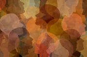 An abstract illustration of overlapping brown, yellow and orange profiles of human heads.