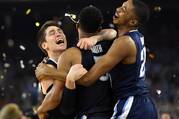 Villanova Wildcats players Ryan Arcidiacono, left, Phil Booth (5) and guard Mikal Bridges (25) celebrate after the team’s championship win of the 2016 NCAA Men's Final Four in Houston.