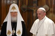 Russian Orthodox Patriarch Kirill of Moscow and Pope Francis pose for photos at the beginning of their meeting at Jose Marti International Airport in Havana.