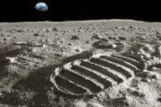 footprint on the moon surface with the earth in the background