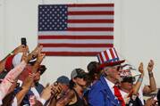 People in Mesa, Ariz., attend a midterm election rally.