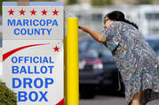 A voter drops off her ballot on Nov. 7, 2022, in Mesa, Ariz. (AP Photo/Matt York, File) 