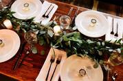 White ceramic dinner plate set on brown wooden table