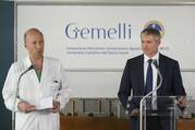 Dr. Sergio Alfieri, left, the chief surgeon who operated on Pope Francis, speaks at a news conference alongside Matteo Bruni, director of the Vatican press office, right, at Rome's Gemelli hospital.