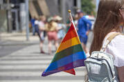 Rainbow flag sticking out of a student's backpack
