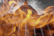 Flames are seen in front of the U.S. Capitol in this photo illustration. (iStock/Douglas Rissing)