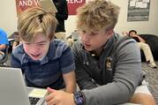 Special needs student Peter Marvin, a freshman, completes an assignment with the assistance of Landon Lewis, a senior and one of his peer mentors, at DeSmet Jesuit High School in St. Louis on Sept. 6, 2023 