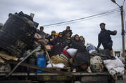 Palestinians arrive in the southern Gaza town of Rafah after fleeing an Israeli ground and air offensive in the nearby city of Khan Younis on Friday, Jan. 26, 2024. Israel has expanded its offensive in Khan Younis, saying the city is a stronghold of the Hamas militant group. (AP Photo/Fatima Shbair)