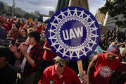 A trend toward goods and components made by unionized American workers may mean higher prices for consumers. In photo: United Auto Workers members attend a rally in Detroit on Sept. 15, 2023. (AP Photo/Paul Sancya, File)
