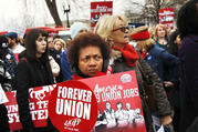 Betty Shadrick, of Albany, N.Y., center, with the United University Professions union, rallies in support of unions outside of the Supreme Court on Feb. 26 in Washington. The court is considering a challenge to an Illinois law that allows unions representing government employees to collect fees from workers who choose not to join. (AP Photo/Jacquelyn Martin)