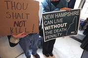 Protestors gather outside the Senate Chamber prior to a vote on the death penalty at the State House in Concord, N.H., Thursday, May 30, 2019. New Hampshire, which hasn't executed anyone in 80 years and has only one inmate on death row, on Thursday became the latest state to abolish the death penalty when the state Senate voted to override the governor's veto. (AP Photo/Charles Krupa)