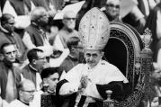 Pope Paul VI makes his way past bishops during a session of the Second Vatican Council in 1964 (CNS file photo)