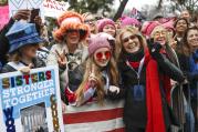 In this Jan. 21, 2017 file photo, Gloria Steinem, center right, greets protesters at the barricades before speaking at the Women's March on Washington during the first full day of Donald Trump's presidency, in Washington. (AP Photo/John Minchillo, File)