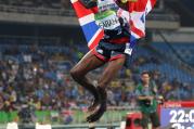Britain's Mo Farah celebrates winning the men's 5000-meter during athletics competitions on Aug. 20. (AP Photo/Lee Jin-man)